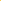 Assorted colorful lip balm tubes on a yellow background